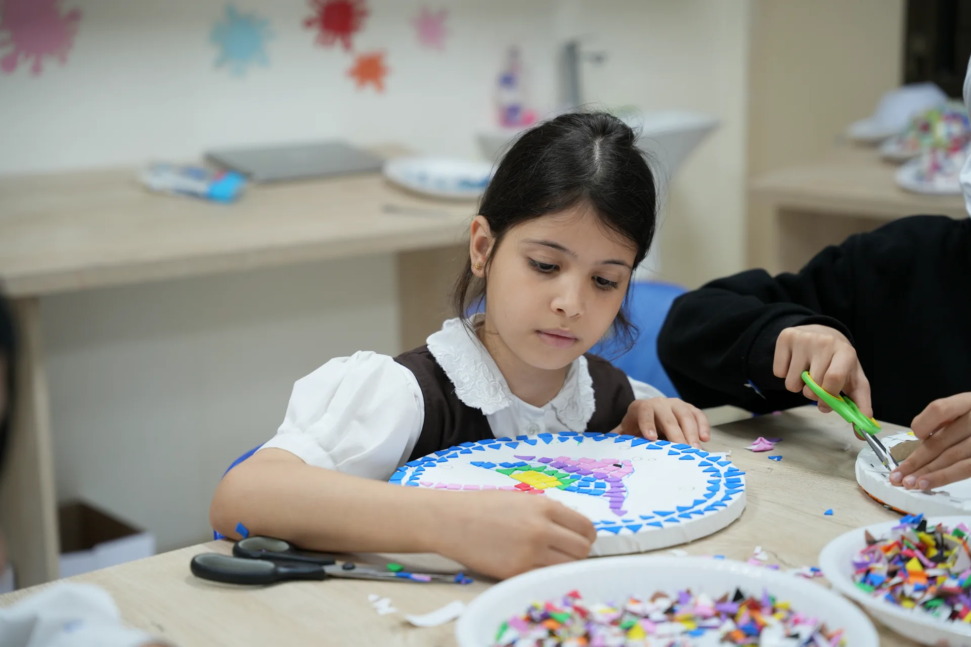 Students painting during an Art activity